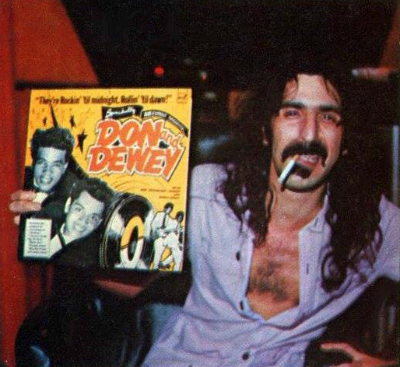 Frank Zappa holds a Don and Dewey album